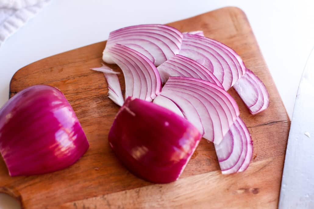 slicing up red onion for pickled red onion