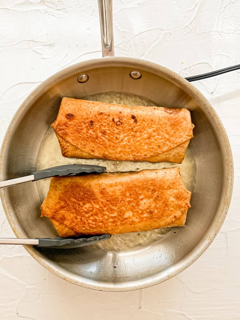frying a chimichanga in a pan