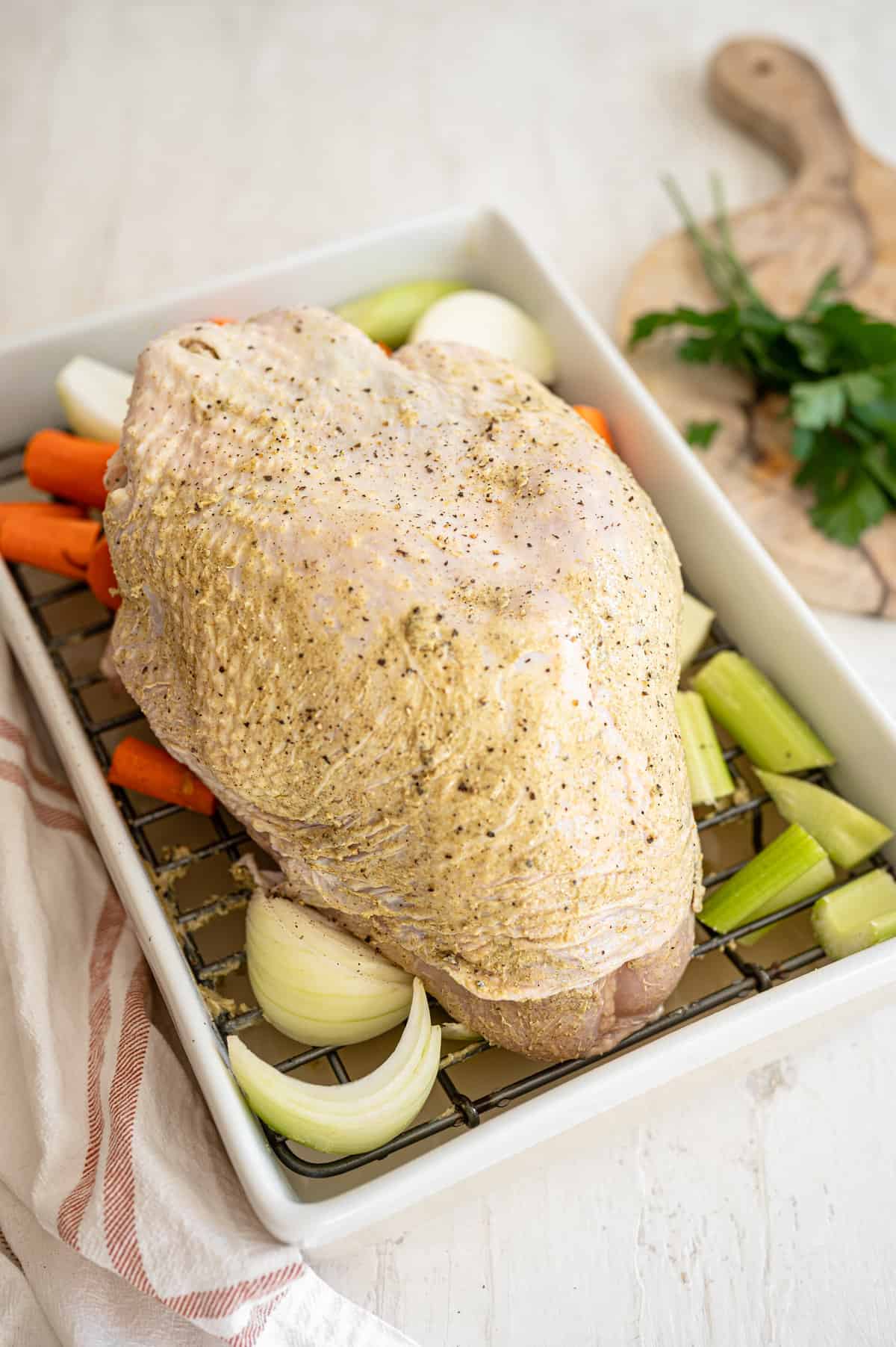 bone-in turkey breast covered in compound butter and stuffed with vegetables