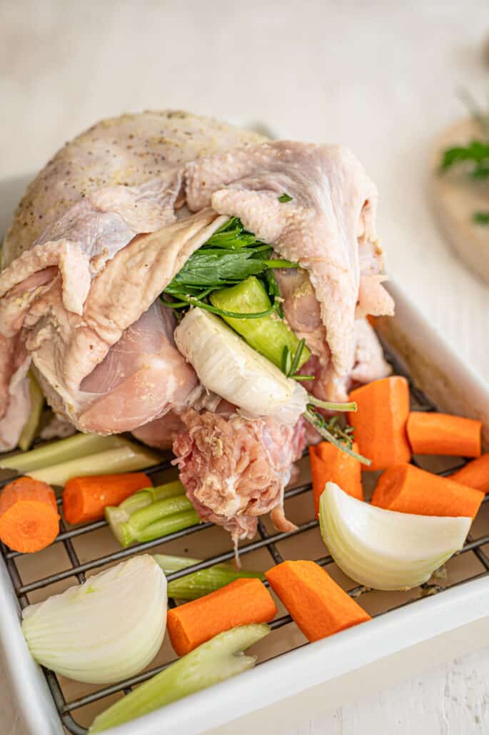 bone-in turkey breast covered in compound butter and stuffed with vegetables