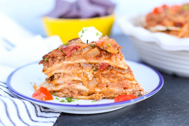 taco pie slice on a white plate.