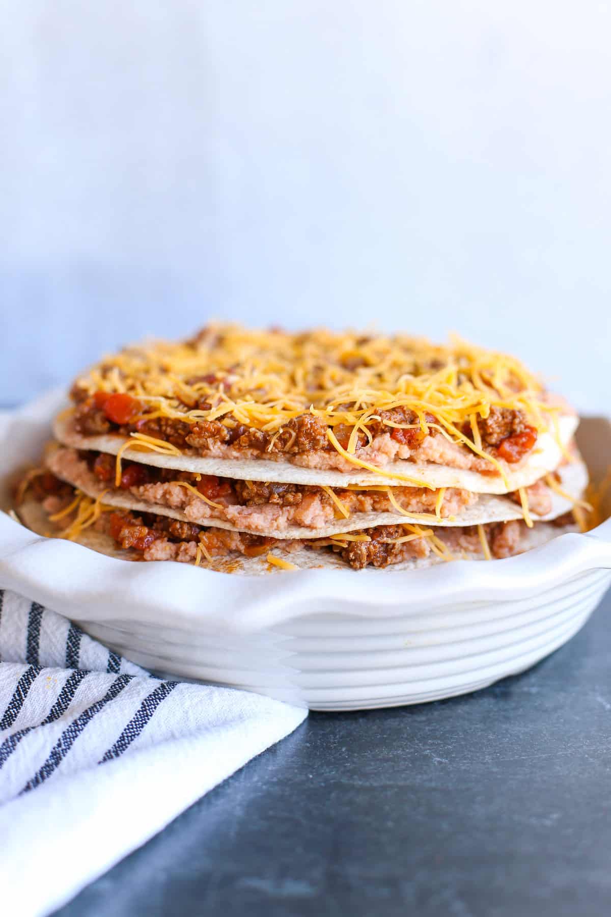 Taco pie assembled in a white pie dish.