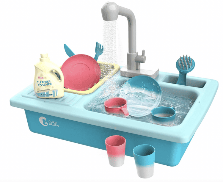 Battery-operated Functional Play Sink in blue with water coming out of the faucet and play dishes in the sink, drainer, and beside the sink.