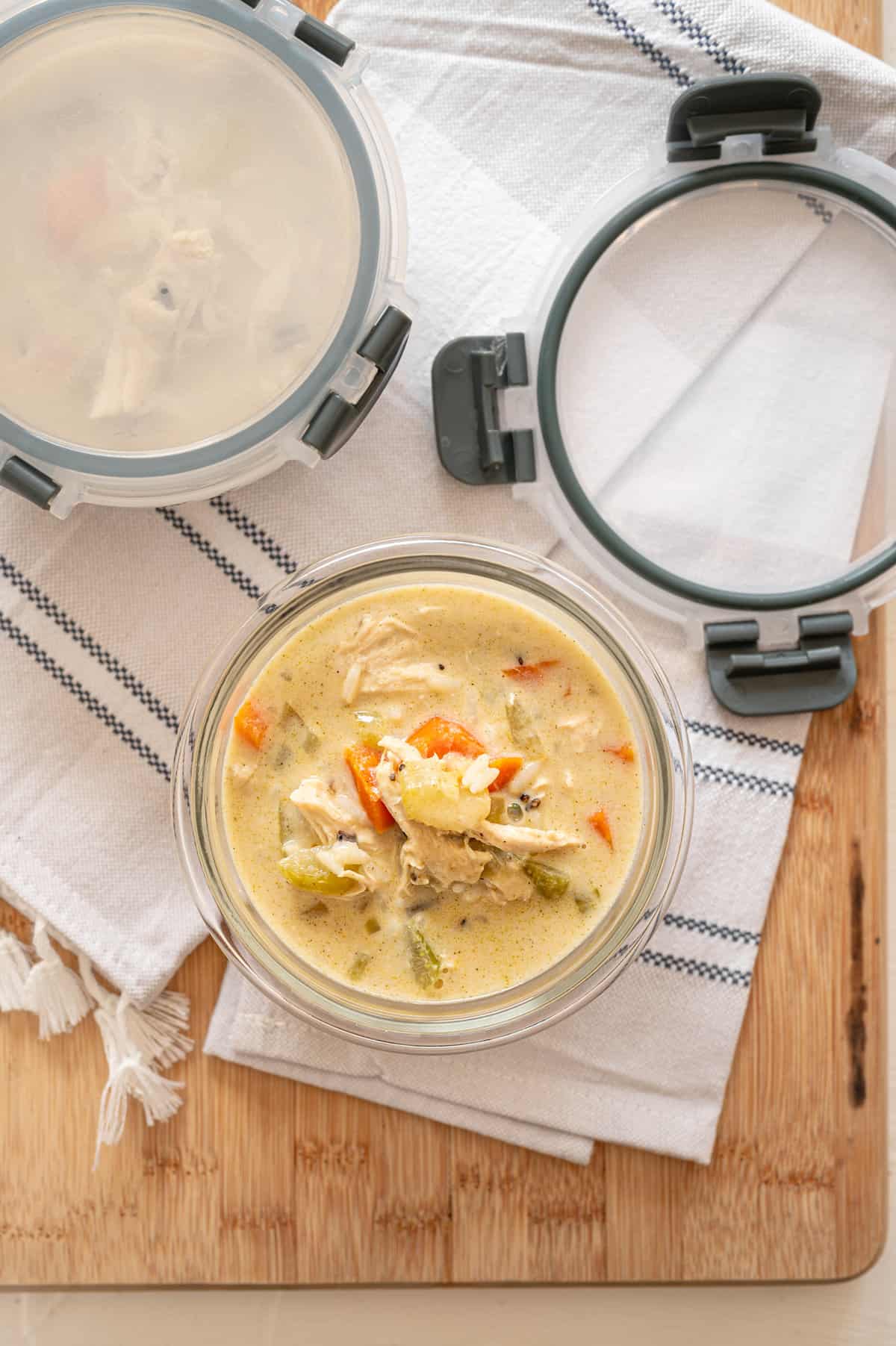 Creamy chicken and wild rice soup in a single-serving freezer container to be frozen.