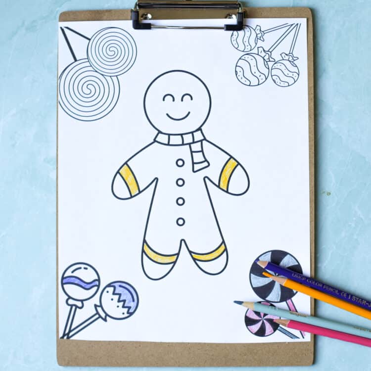 Partially colored gingerbread man coloring sheet on a clipboard.