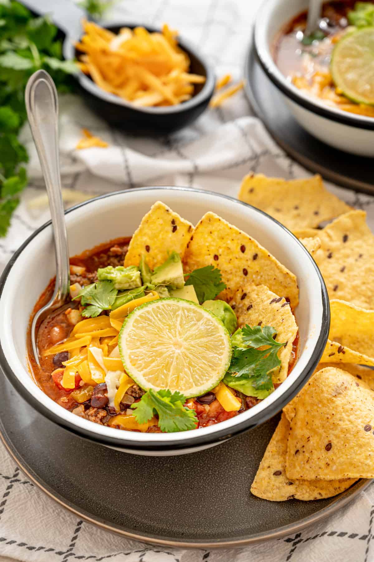 Mexican Soup in a bowl with tortilla chips.