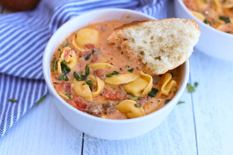 Sausage and tortellini soup in a bowl.