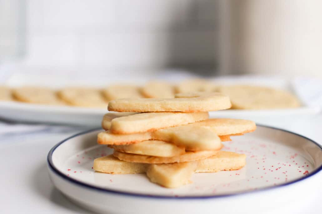 Cooked cream cheese sugar cookies stacked up