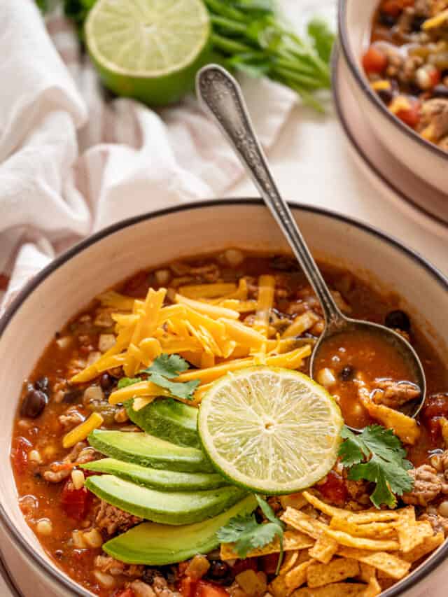 instant pot taco soup recipe in a bowl with a spoon.
