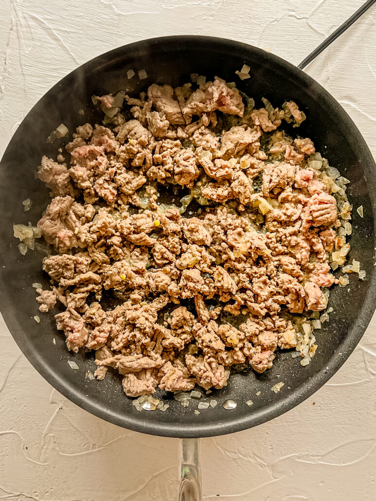 browned ground beef in a pan