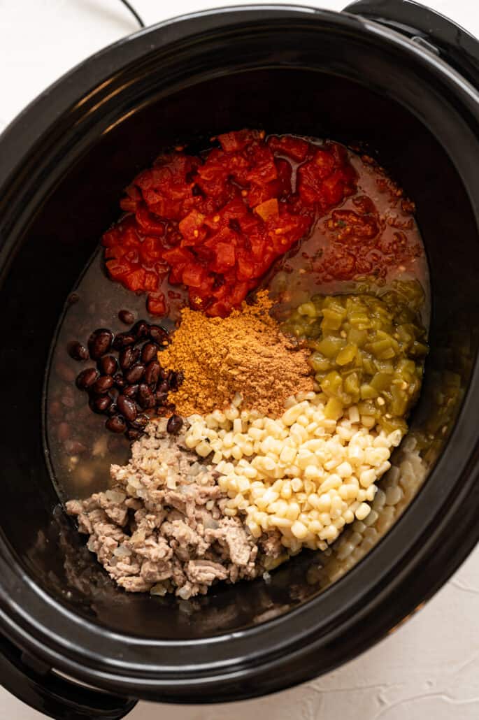 taco soup ingredients in a crock pot