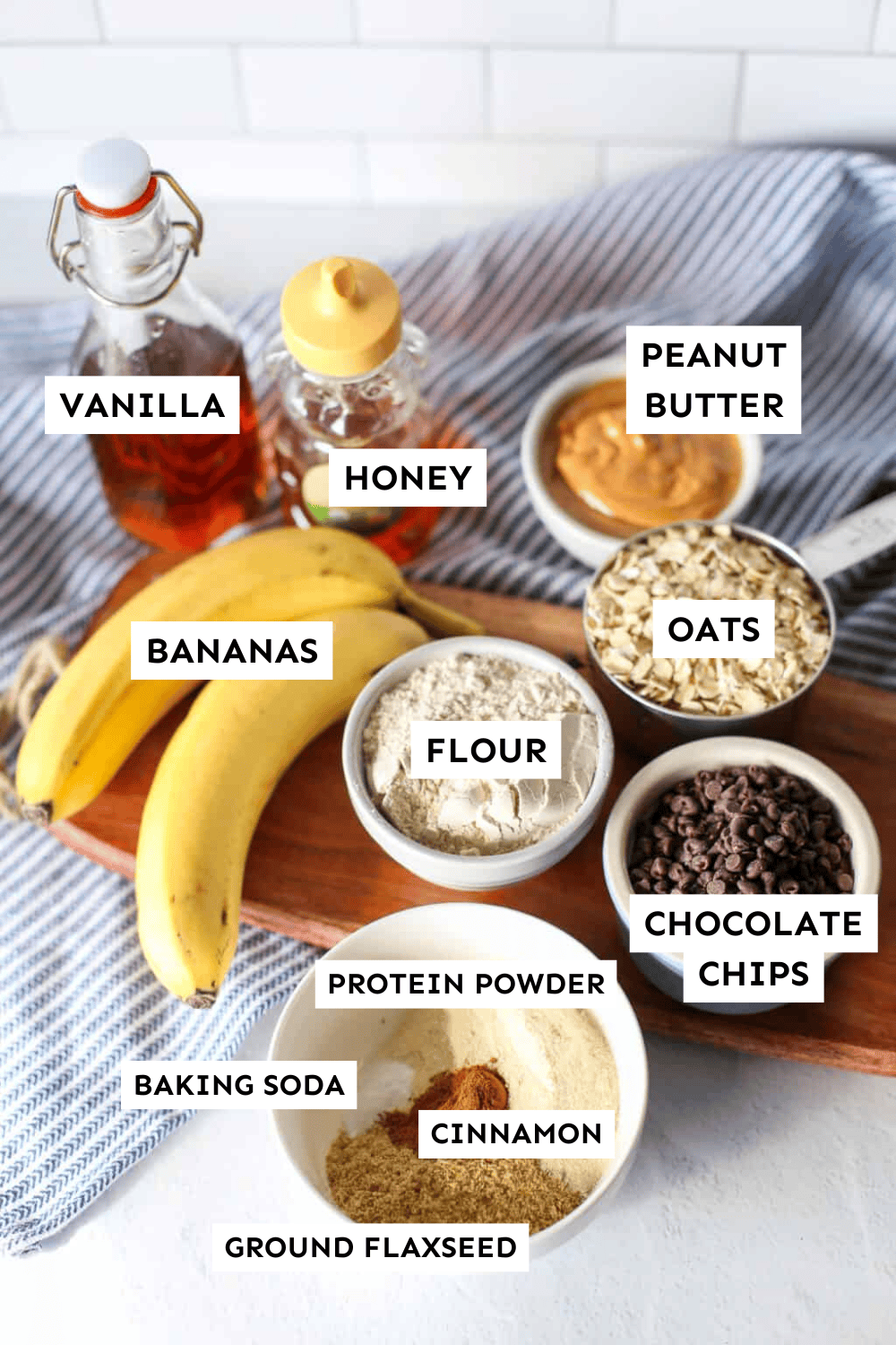 Ingredients for banana breakfast cookies measured out on a counter and labeled.