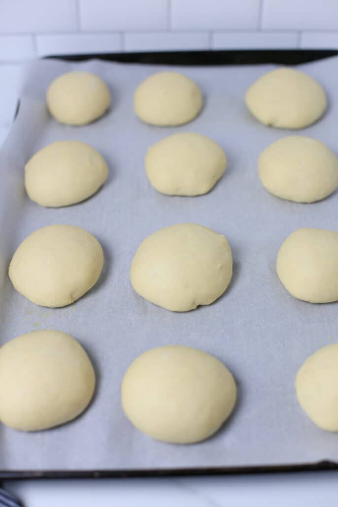 dough rising on a baking sheet