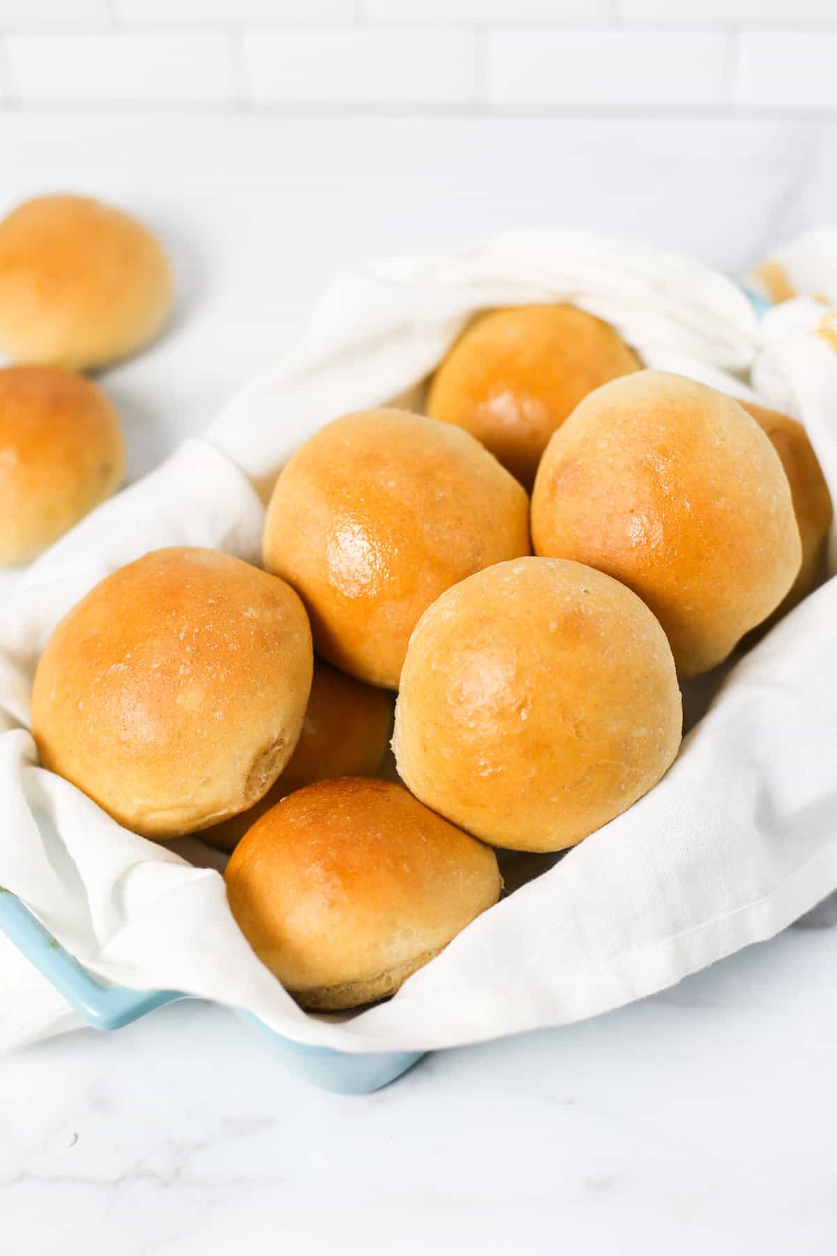 bread machine wheat rolls piled up