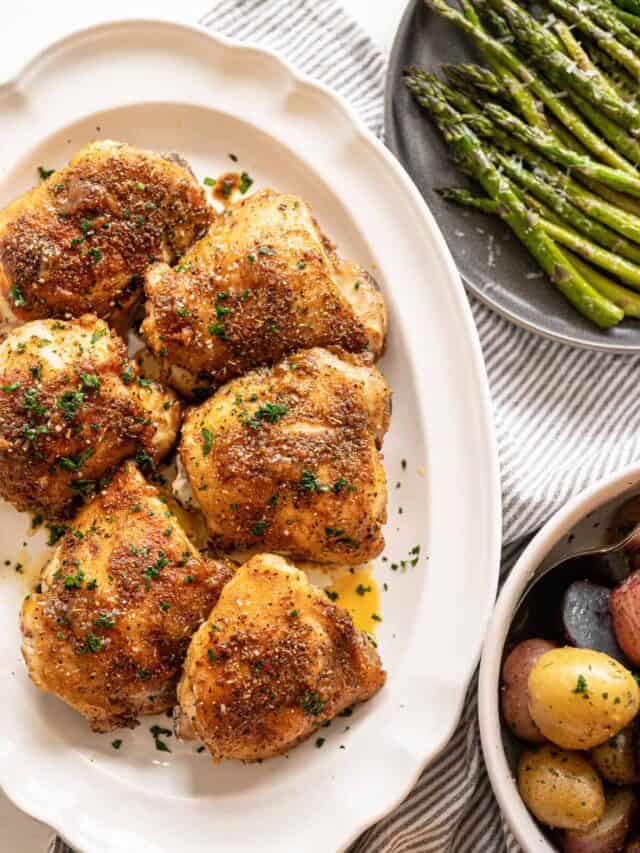 Italian Baked Chicken Thighs on a white platter