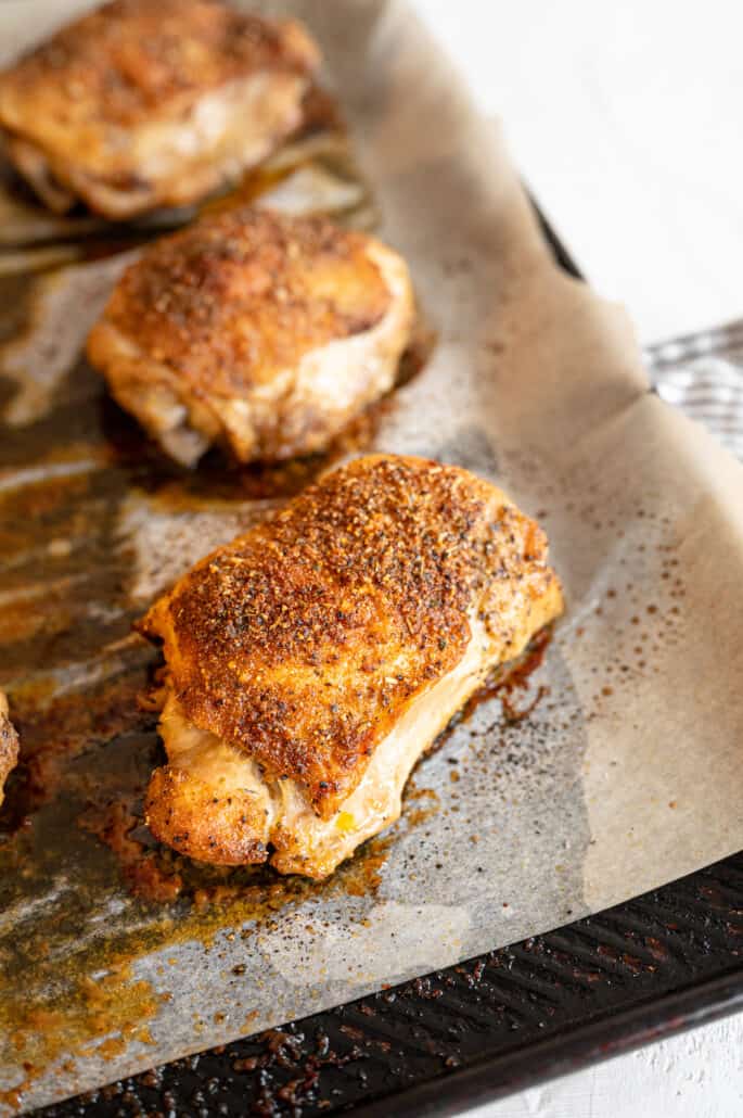 Baked Chicken thighs on a baking sheet