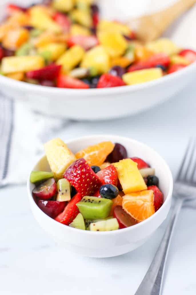 fruit salad in a small white bowl