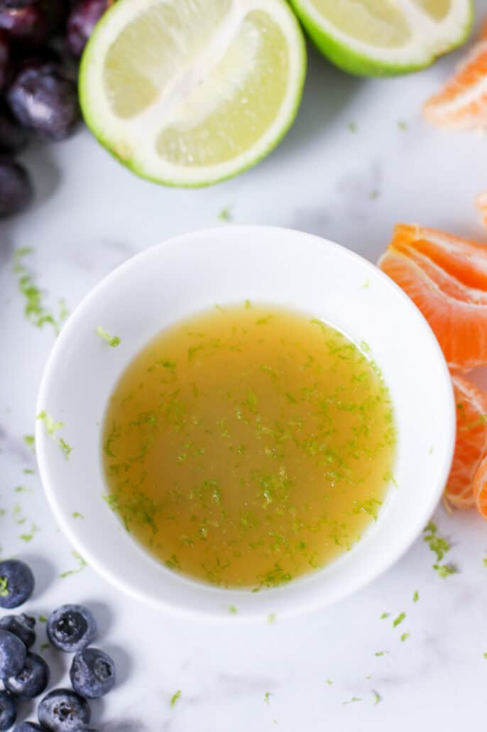 fruit salad dressing in a white bowl