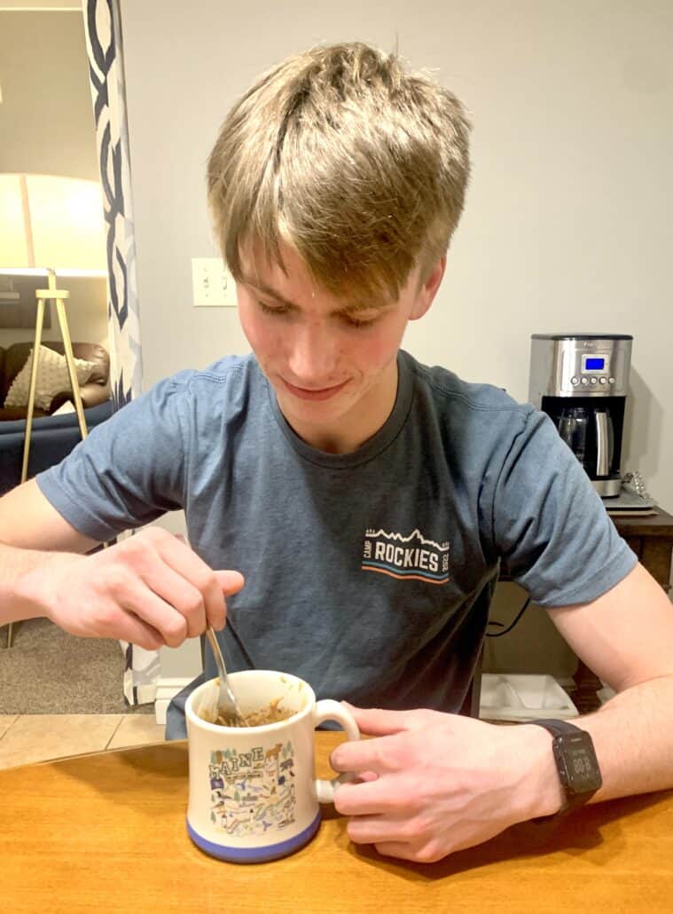 teen boy eating mug cake