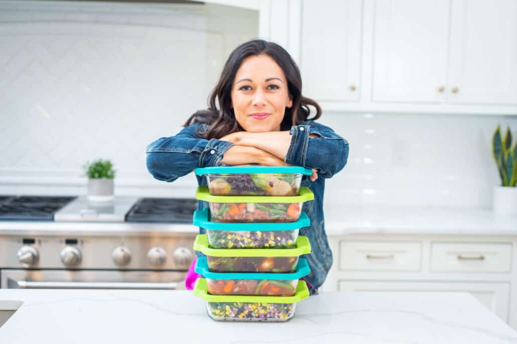 Polly Conner with a stack of freezer meals. 