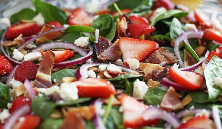 Close up of strawberry spinach salad