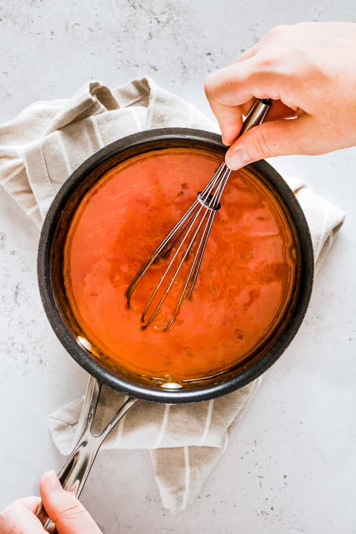 Ingredients for curry sauce being whisked together.
