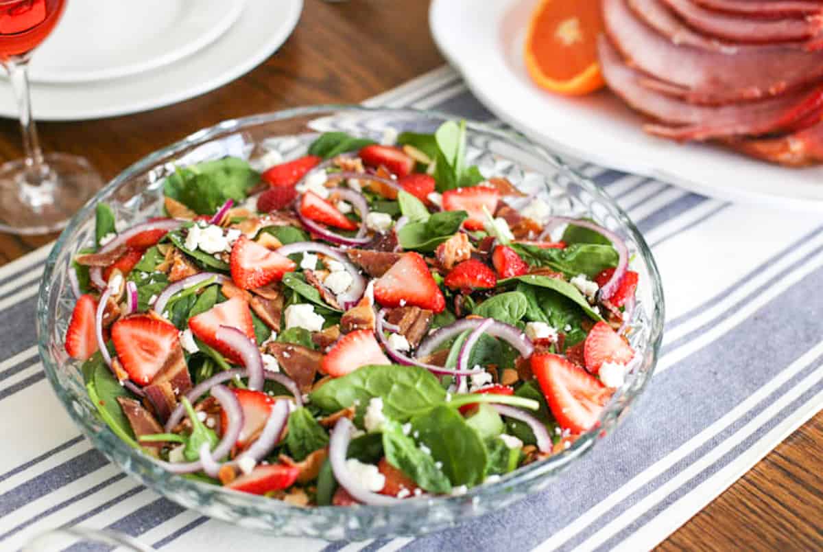Strawberry Spinach Salad in a glass serving bowl.