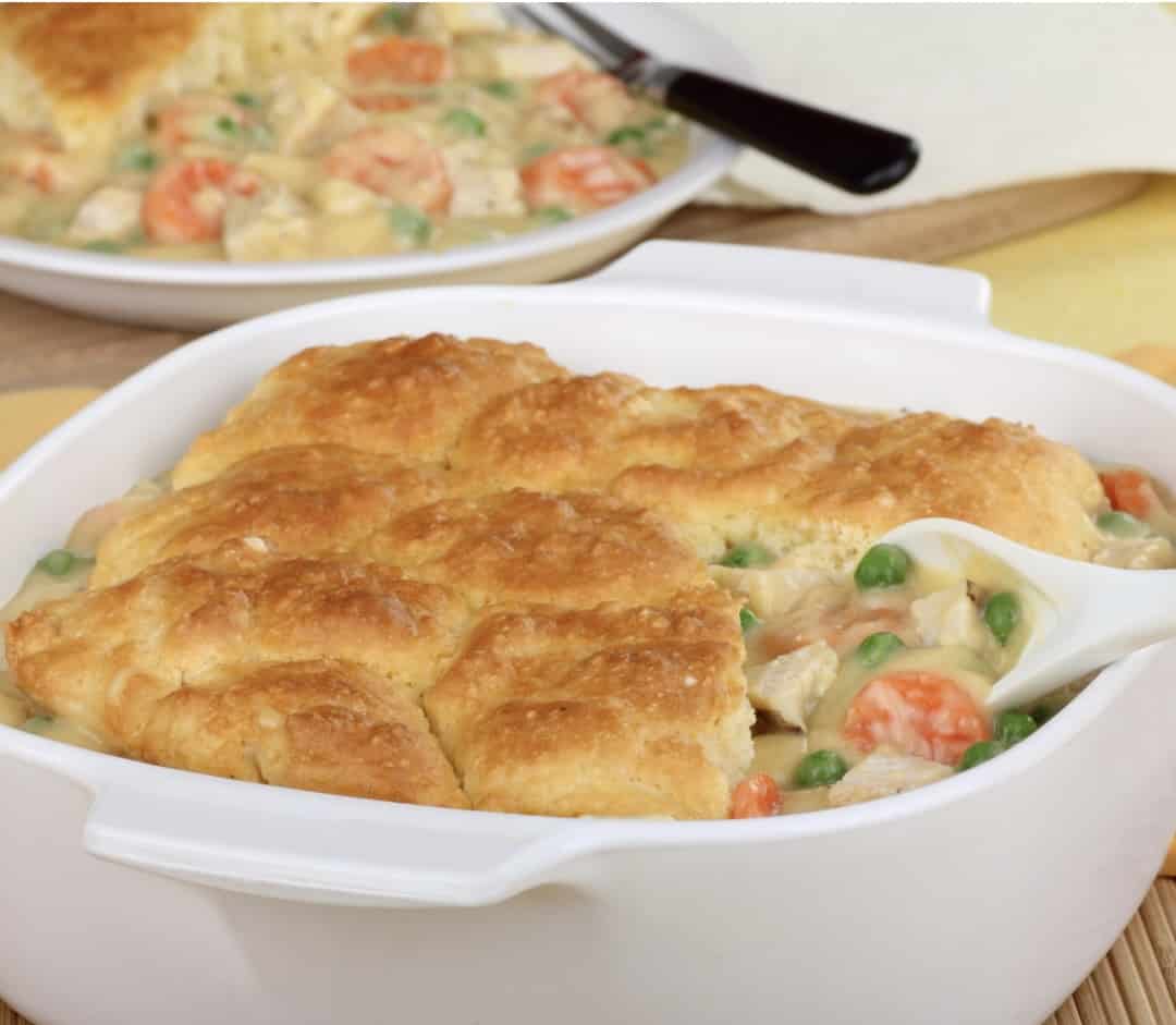 Chicken pot pie filling with biscuits baked on top.