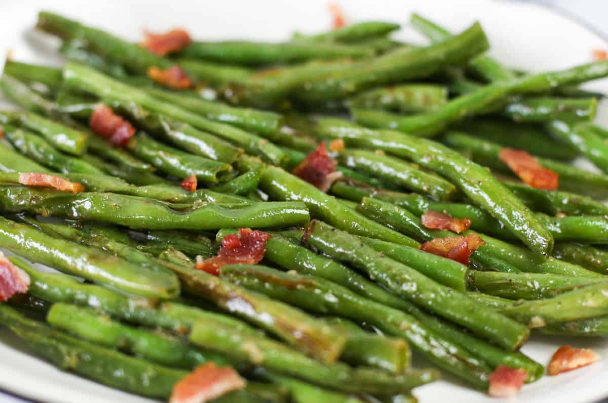 Garlic green beans with bacon sprinkled on top ready to be served.