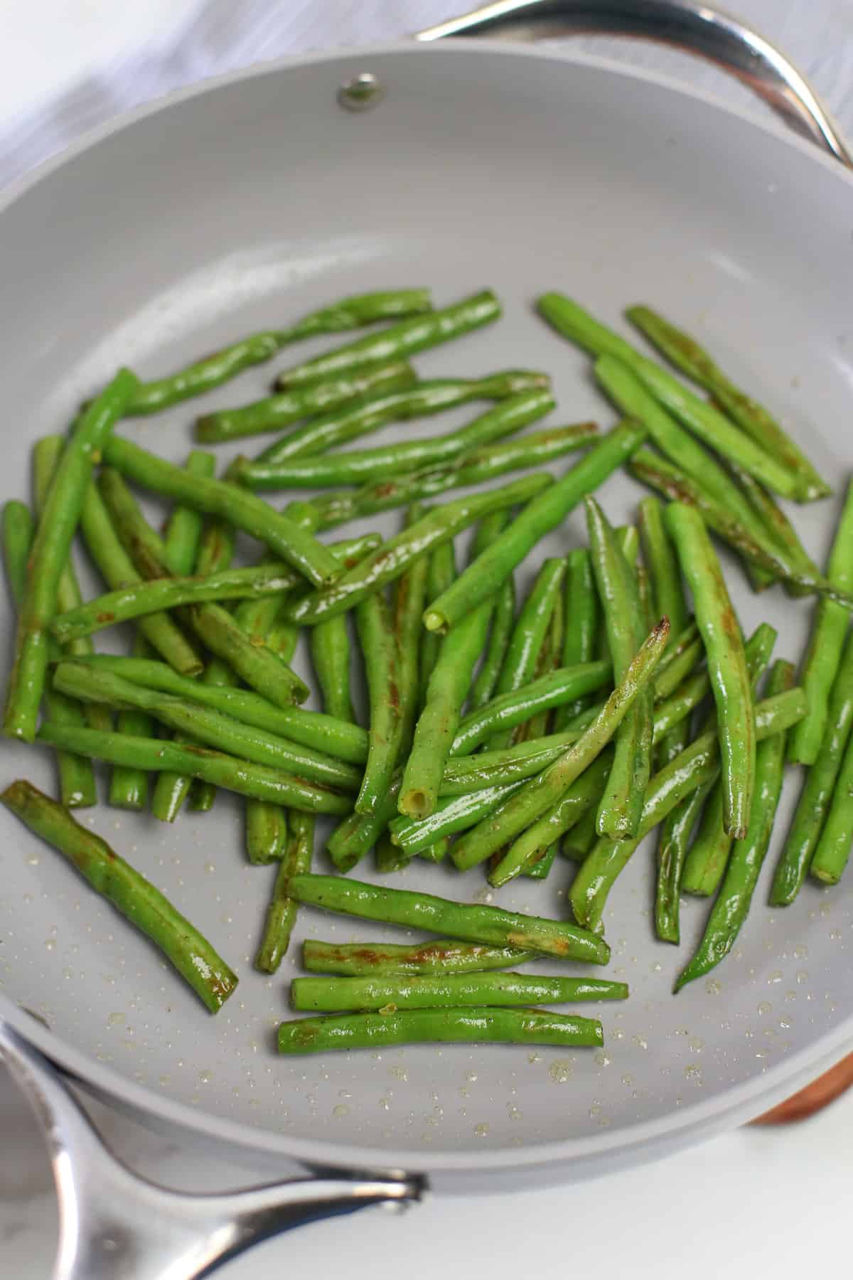 green beans added to saute pan