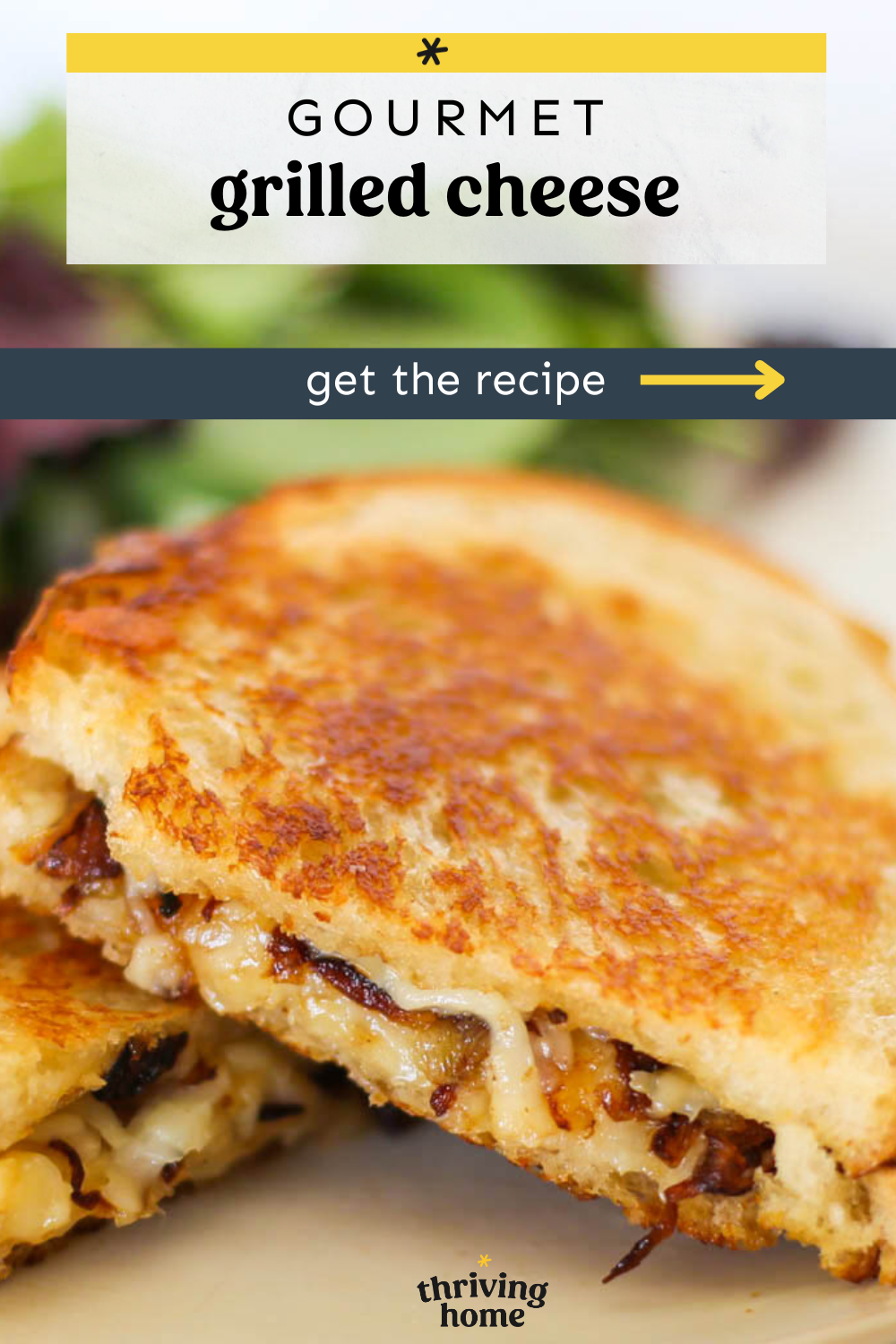 Two gourmet grilled cheese sandwiches stacked.