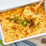 Hashbrown casserole in a white baking dish.