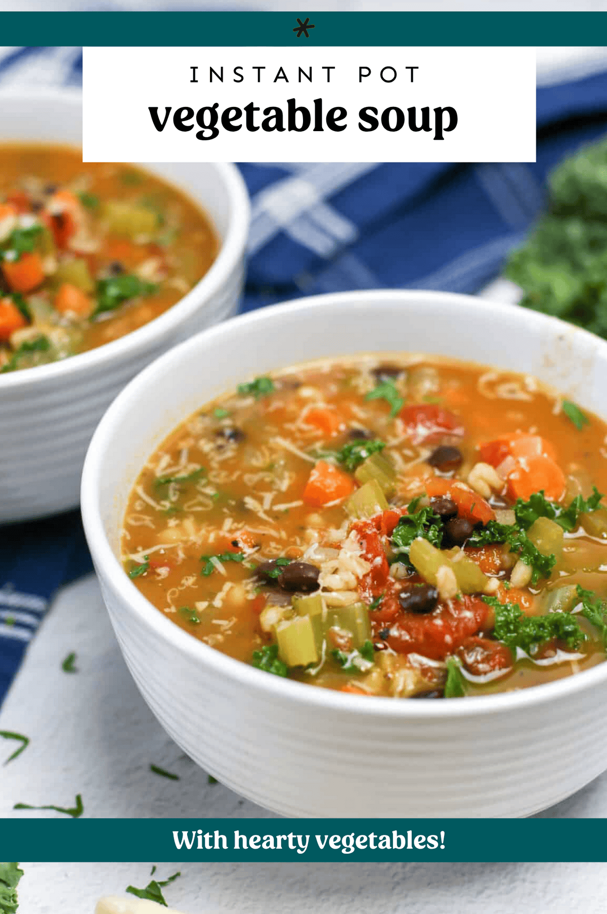 Two bowls of vegetable soup with shredded Parmesan cheese.