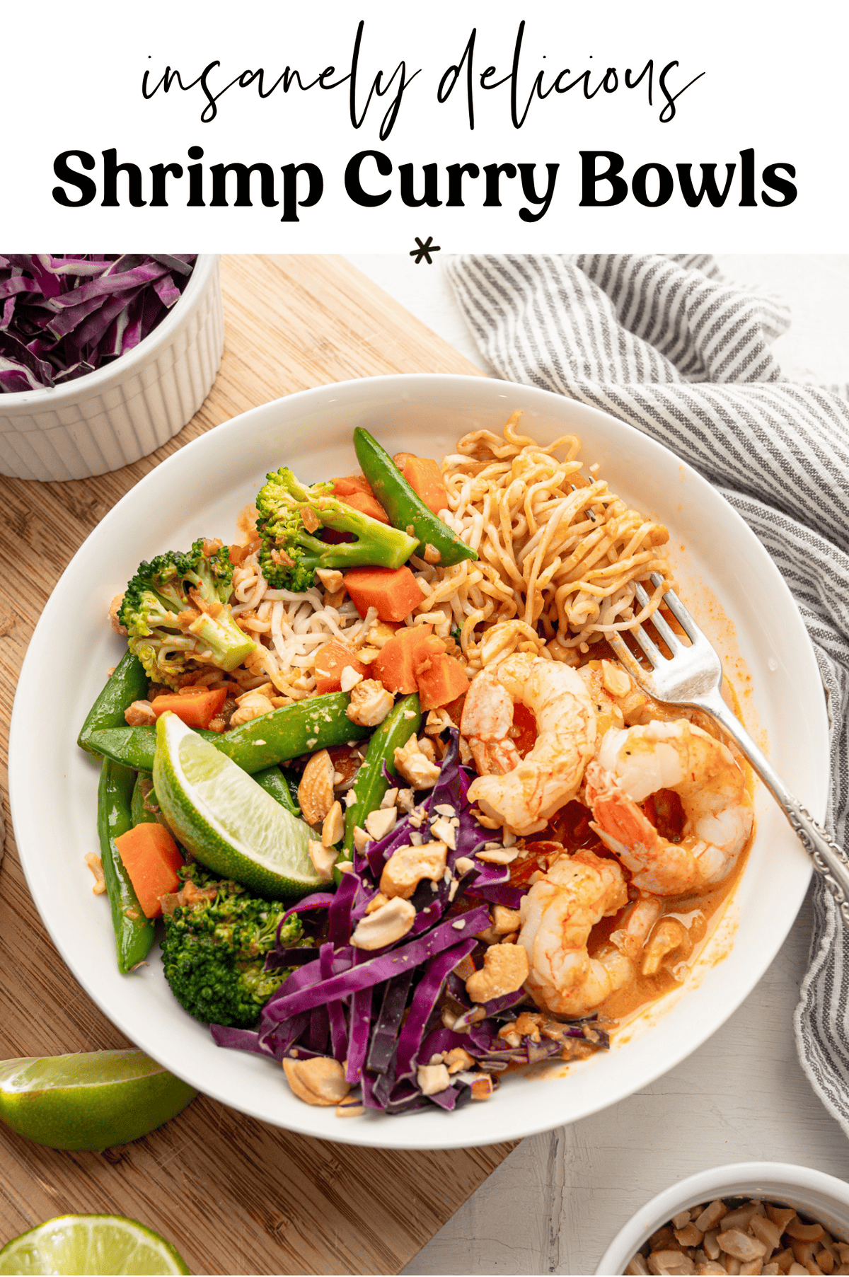 Shrimp curry bowl ready to eat with fork and cloth napkin.