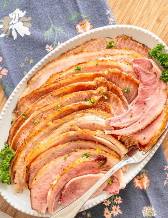 Crockpot ham slices on a serving platter.