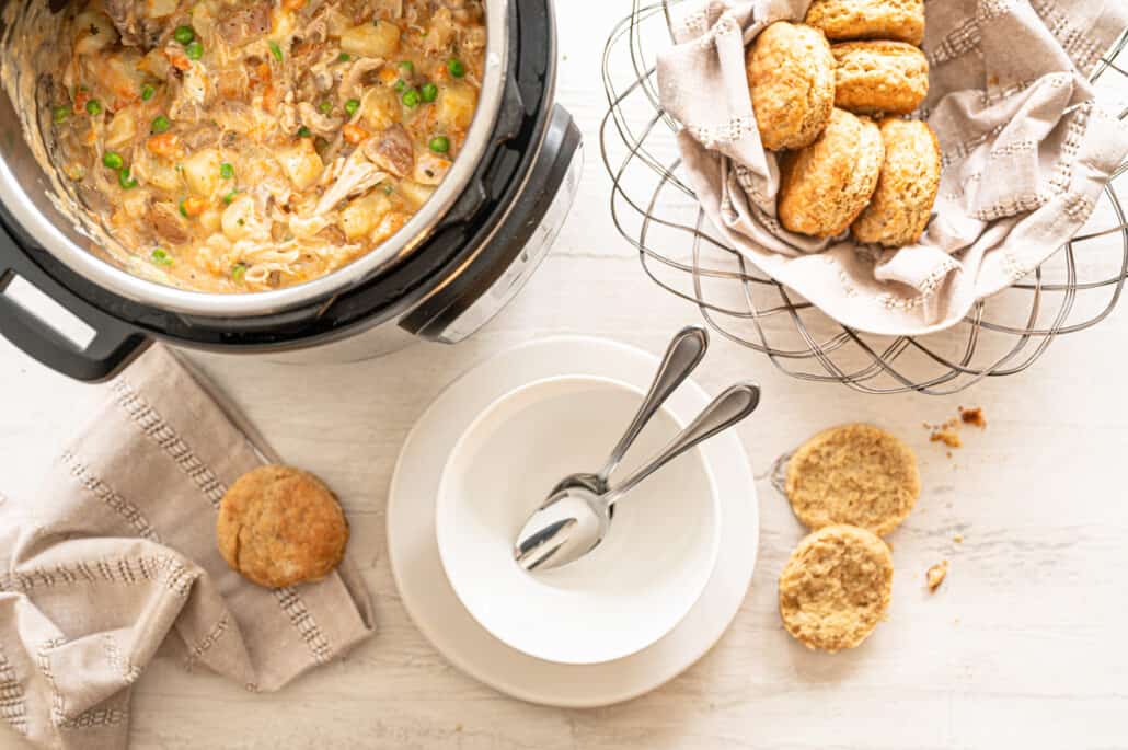 hero shot of cooked chicken pot pie in Instant Pot with biscuits