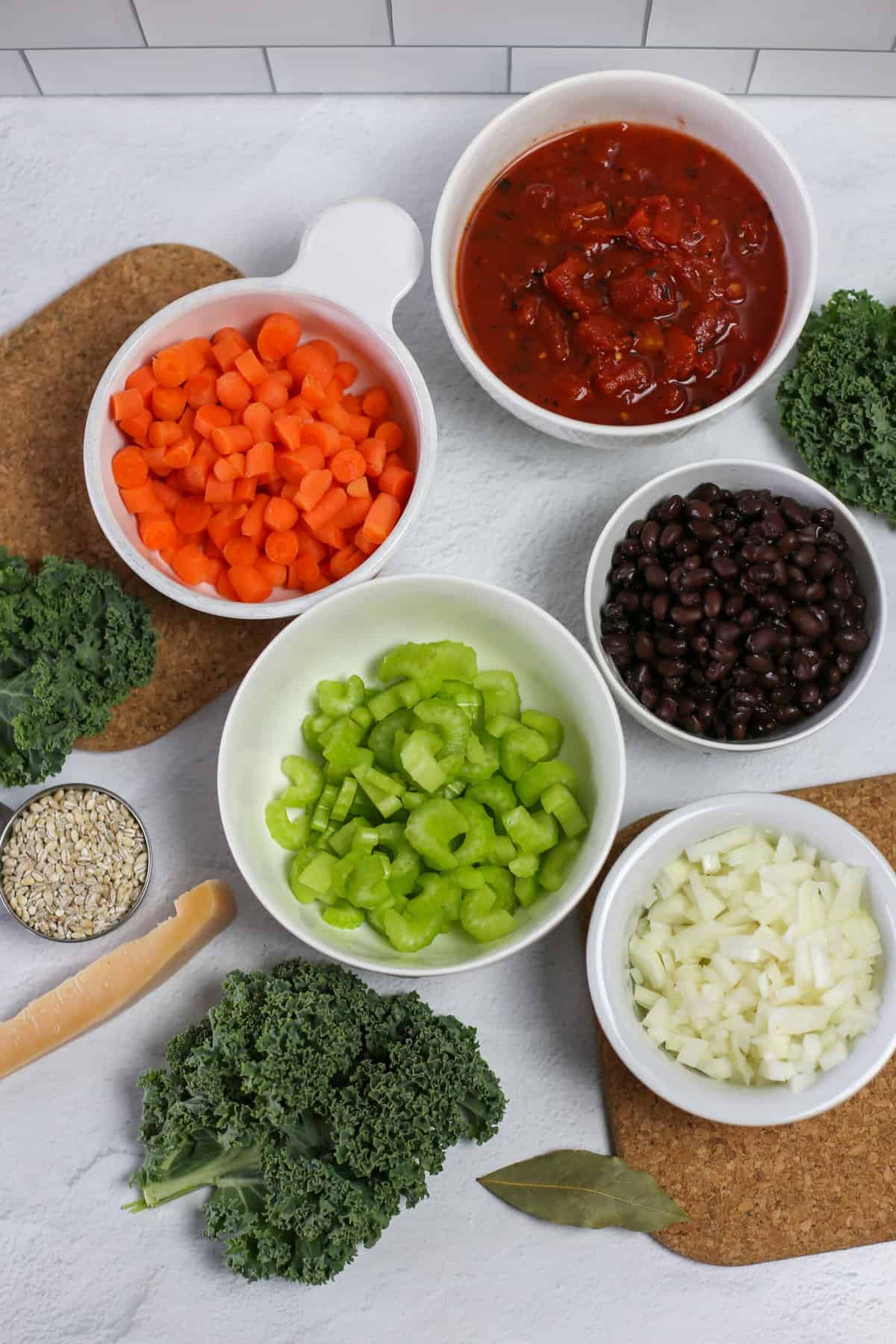 Ingredients for instant pot vegetable soup measured into bowls and setting on the counter.
