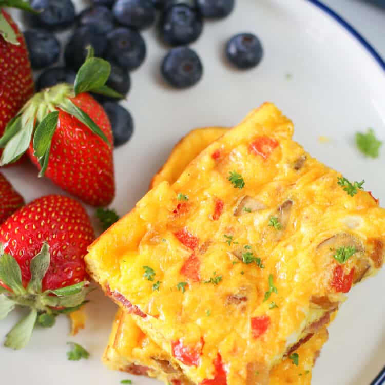Baked Omelette on a plate with strawberries and blueberries