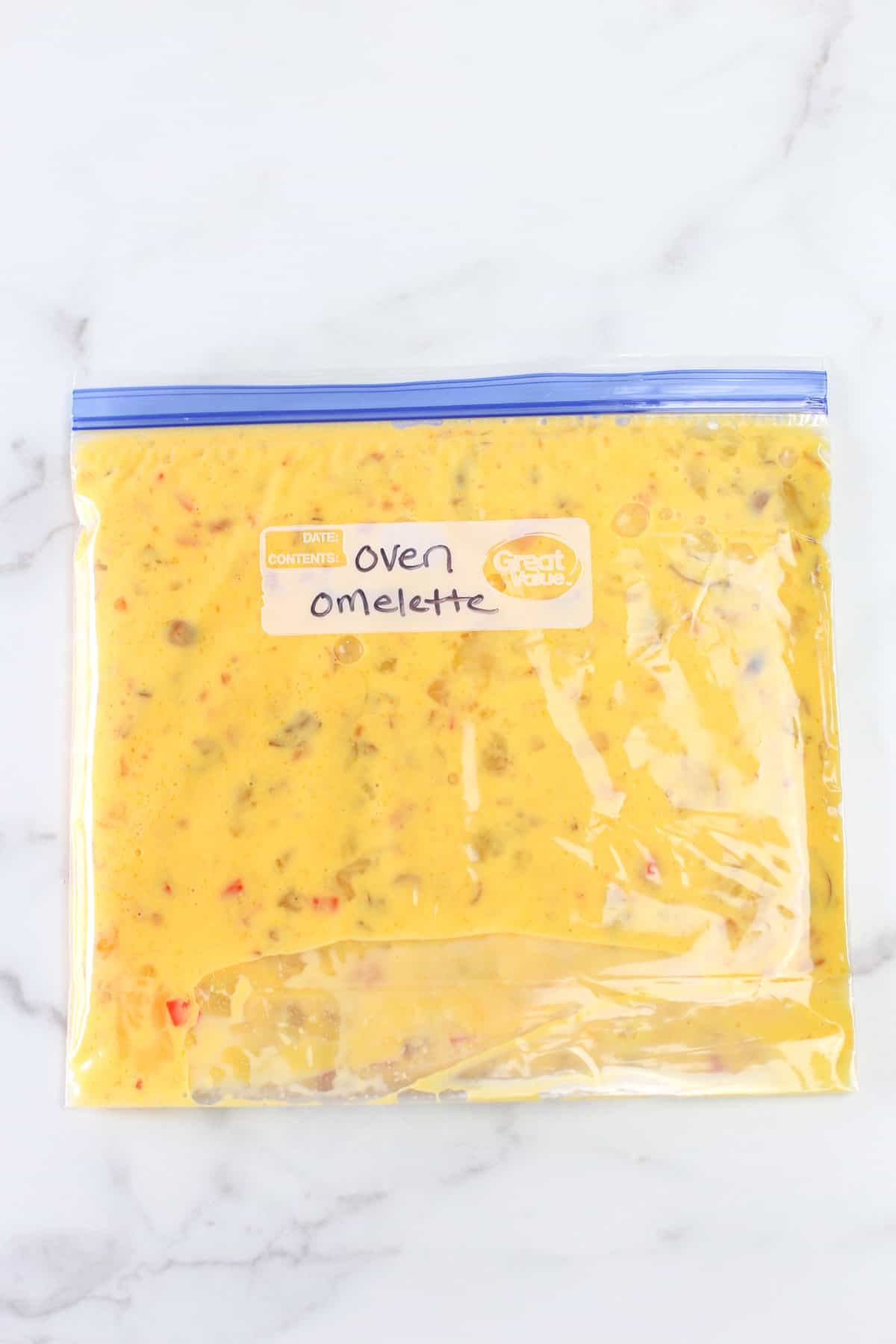 Uncooked oven omelette mixture in a freezer bag and labeled ready for the freezer.