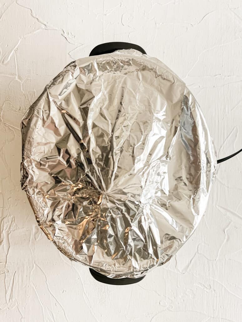 foil covering a large slow cooker