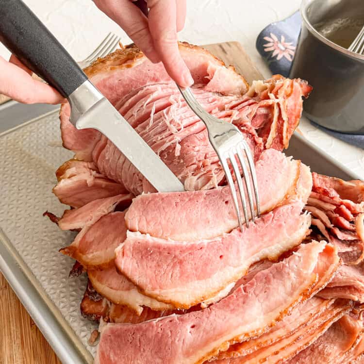 Action shot of carving a ham.