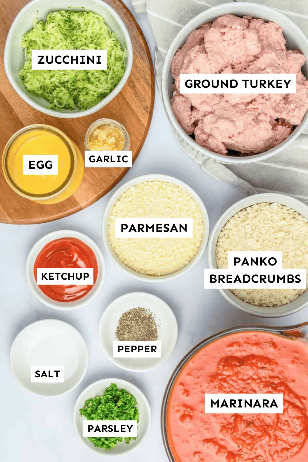 Turkey meatball ingredients measured out and labeled.