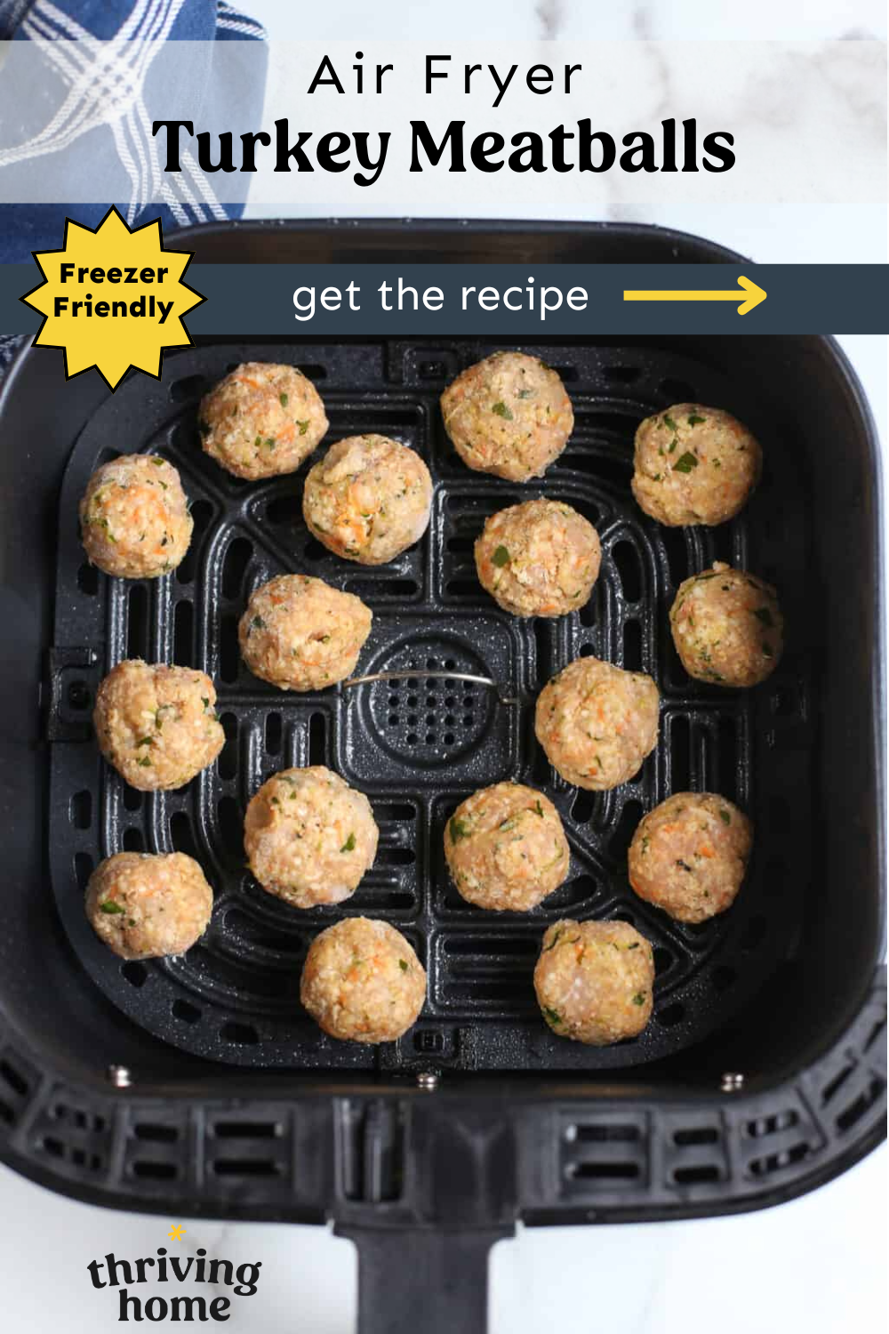 Turkey meatballs lined up in an air fryer ready to cook.