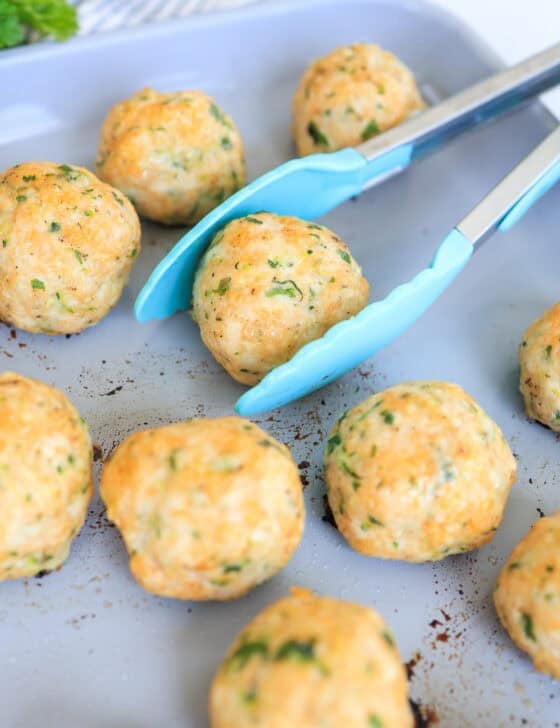 turkey meatballs that have been baked on a sheet pan.