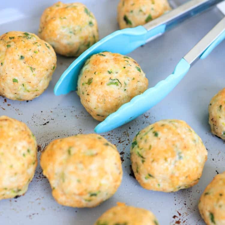 turkey meatballs that have been baked on a sheet pan.