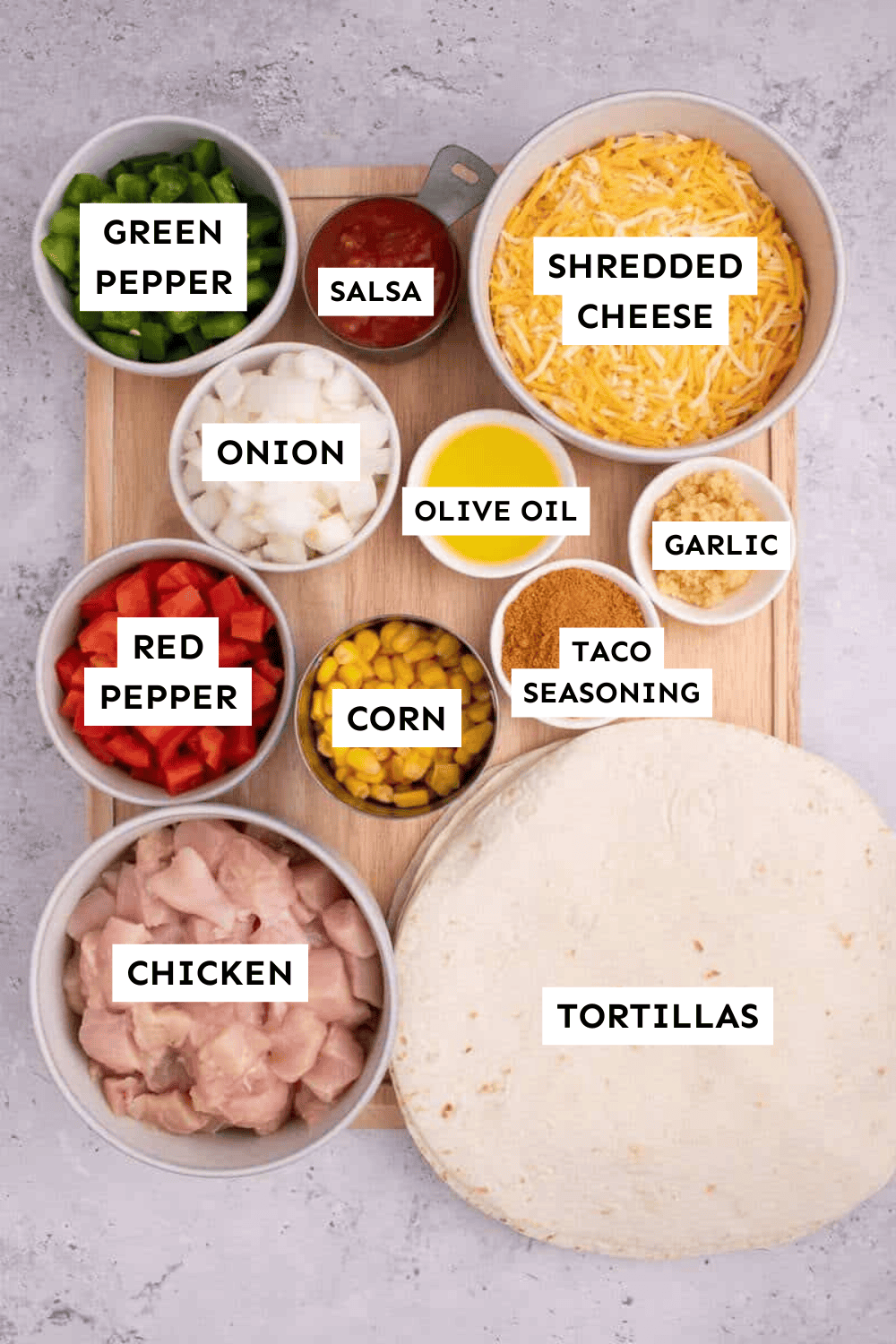 Chicken fajita casserole ingredients measured out and labeled.