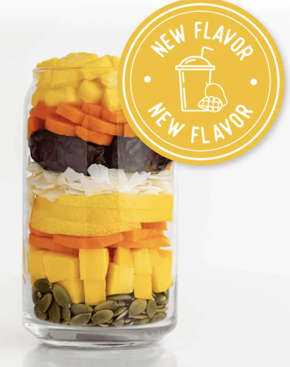 Stock photo of raw ingredients in a glass for the Mango smoothie flavor from SmoothieBox.