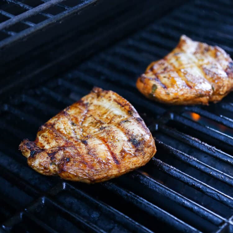 grilled chicken cutlets on a gas grill.