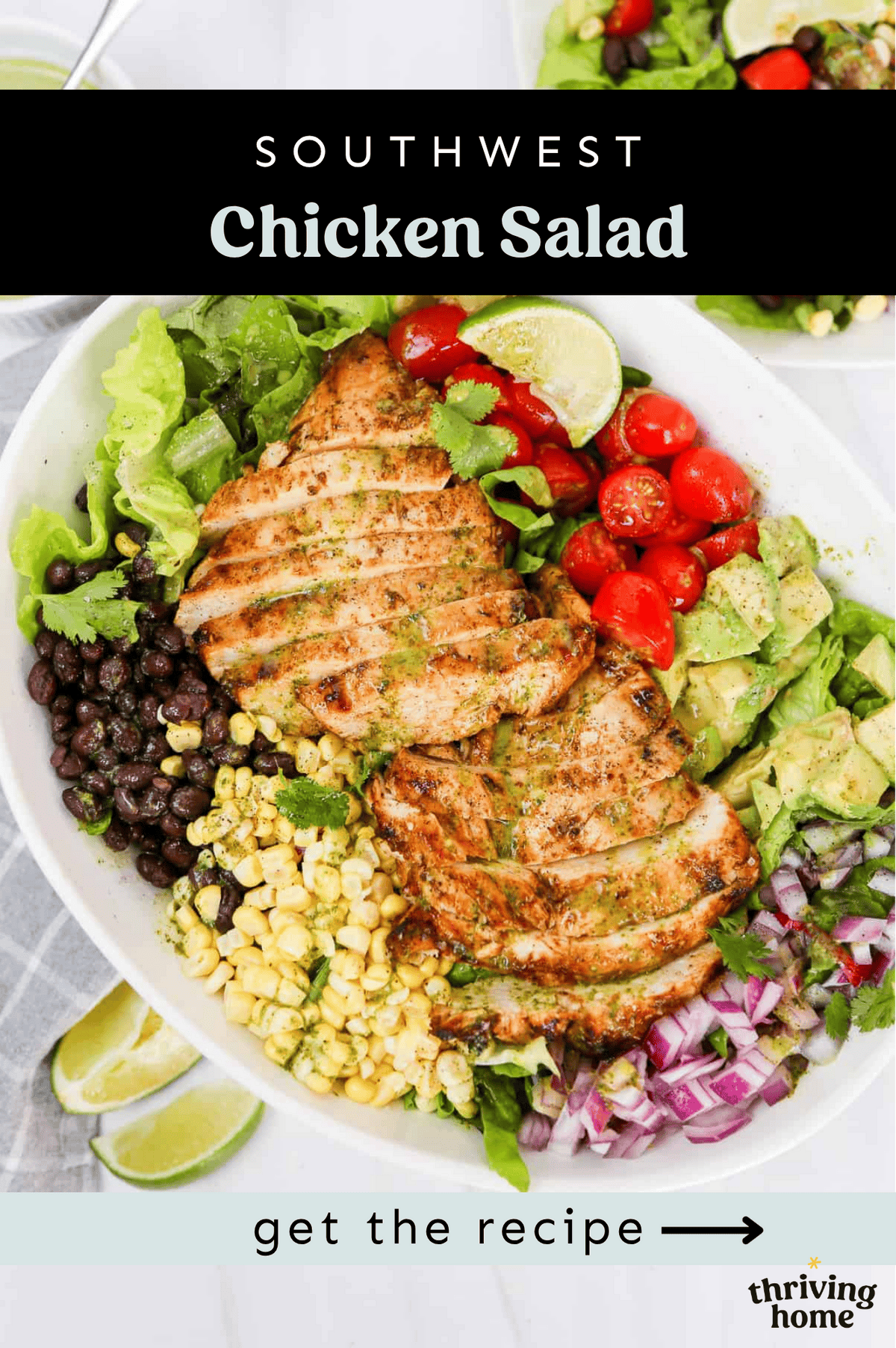 Two Southwest chicken breasts in slices with corn, black beans, Avocado chinks, red onion, tomatoes, lime wedges, and lettuce on a platter.