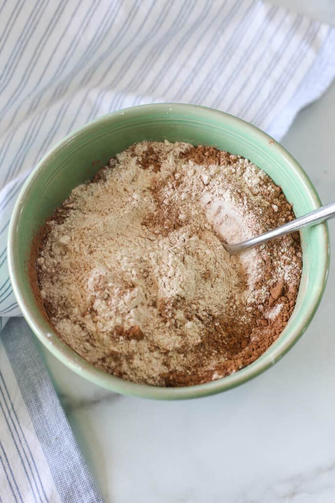 Dry ingredients for zucchini waffles in a bowl